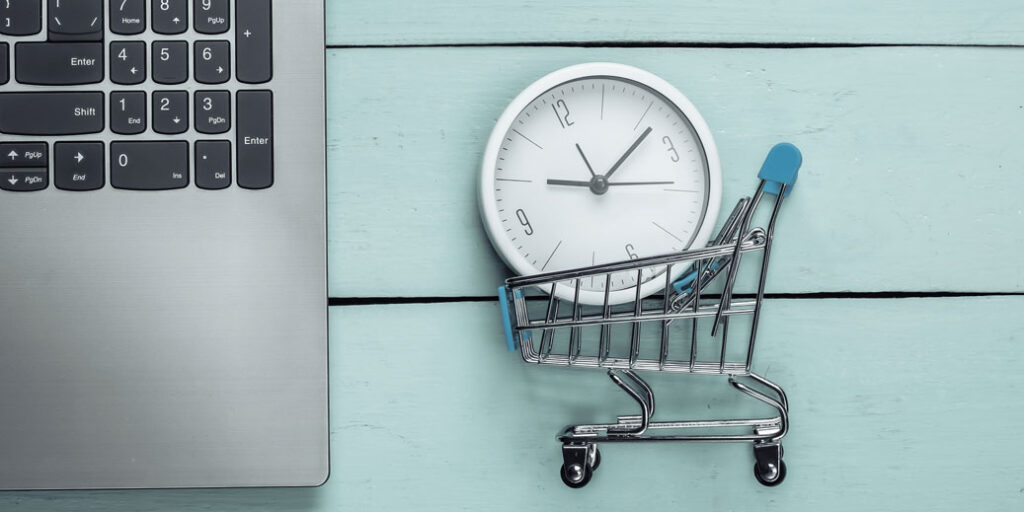 Carrito con relorj representando el tiempo de carga, tiempo de visita en tu tienda online